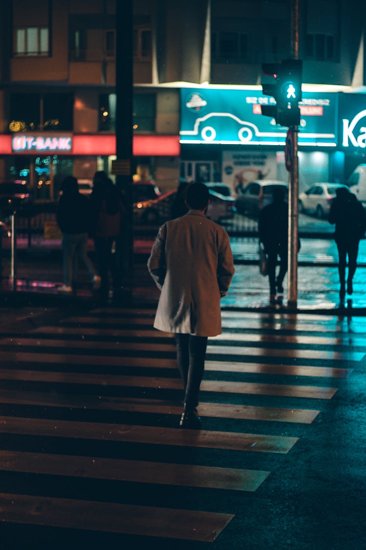 Man Crossing Street At Night