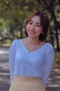 Smiling Woman in White V Neck Shirt