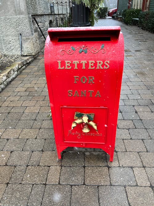 Free Red Mailbox on Gray Brick Floor Stock Photo
