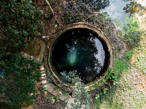 Free Top view of a circular well surrounded by greenery in Rampur, Nepal. Stock Photo