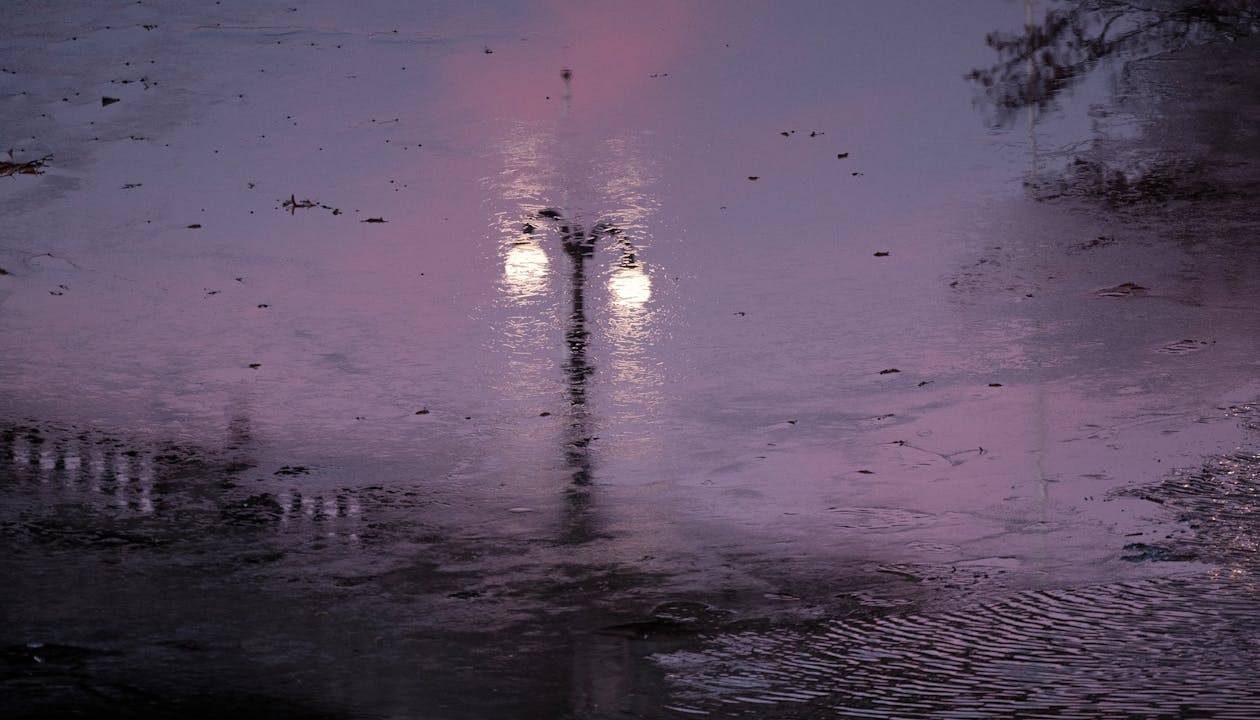 A Reflection of a Lamppost in a Puddle