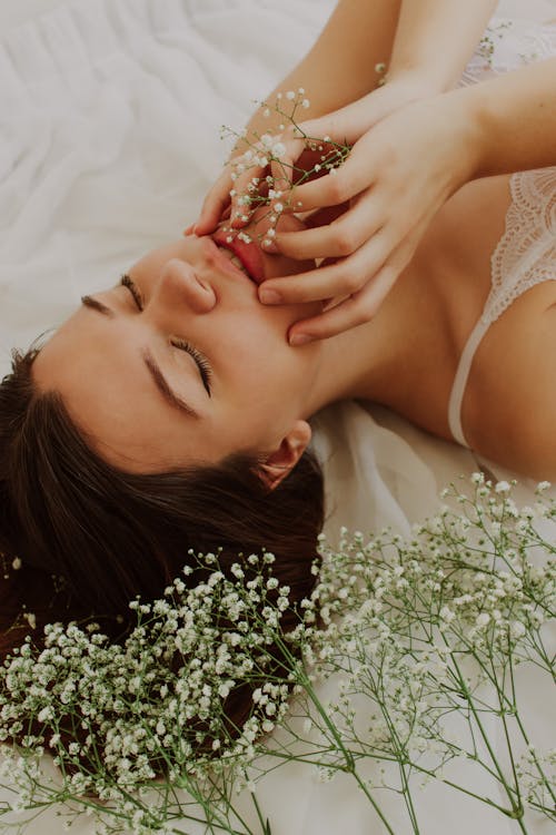 Free Woman Lying With Flowers Stock Photo