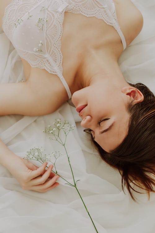 Free Woman Lying with Flower Stock Photo