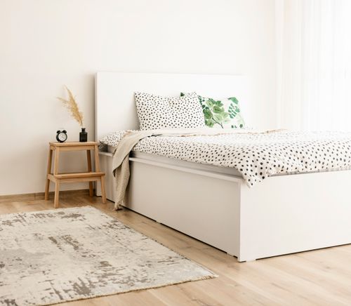 Free Elegant scandinavian-style bedroom with polka dot bedding and natural decor elements. Stock Photo