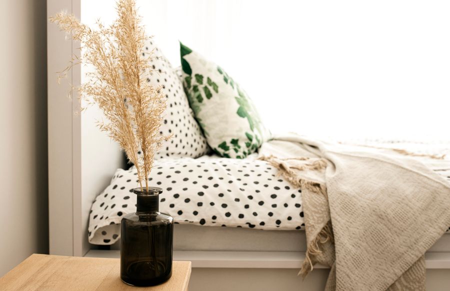 Feng shui bedroom with single nightstand showing asymmetric furniture arrangement affecting energy balance