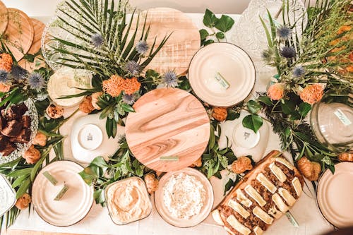Flowers and Food on Bowls and Trays on a Table