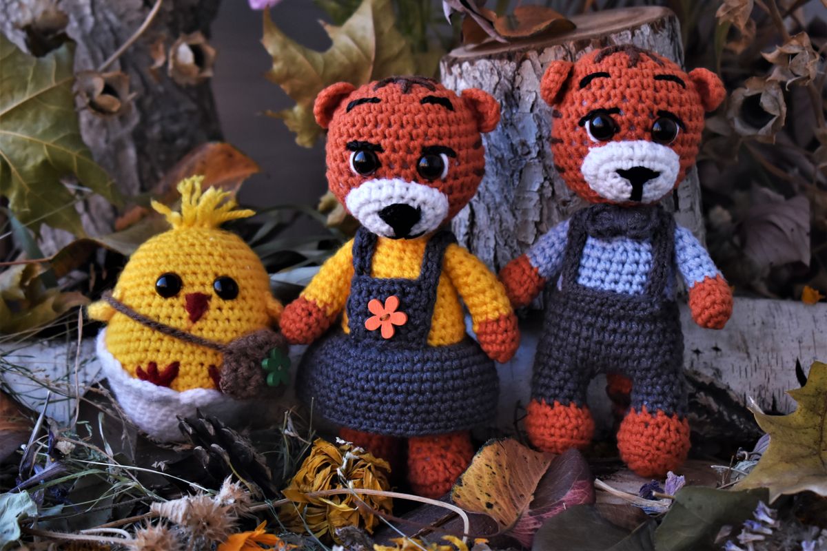 Crocheted flower-shaped baby rattle toy in bright colors
