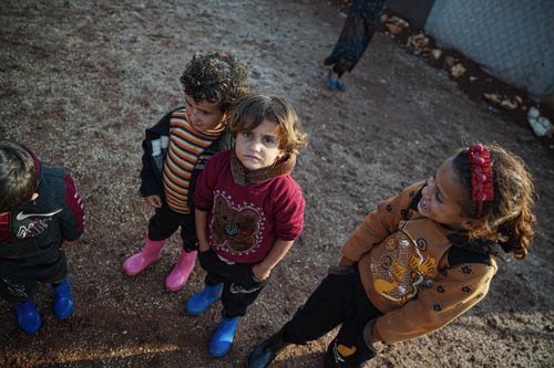 Free A group of children playing outdoors in Idleb, Syria, showcasing resilience and innocence. Stock Photo