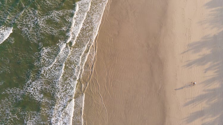 Person On Bicycle On Beach