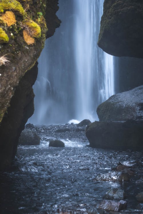 Free Cave Behind a Waterfall Stock Photo