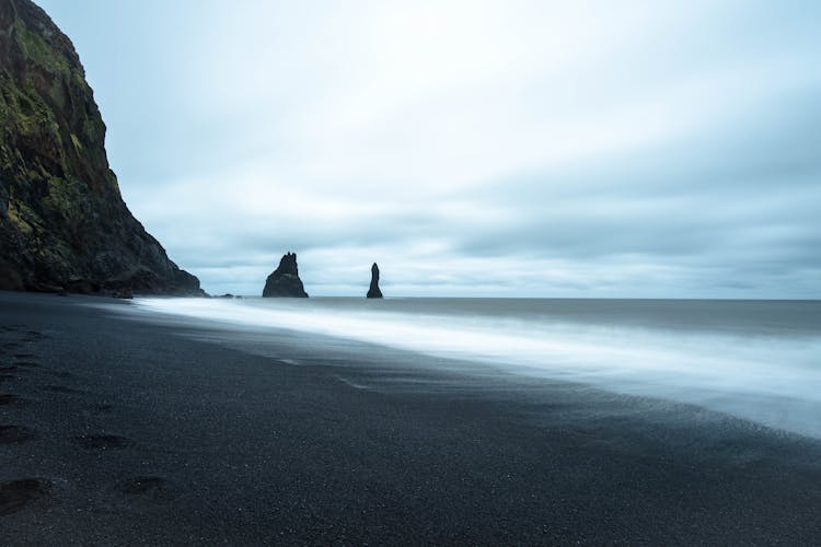 Waves Crashing On A Black Sand Beach