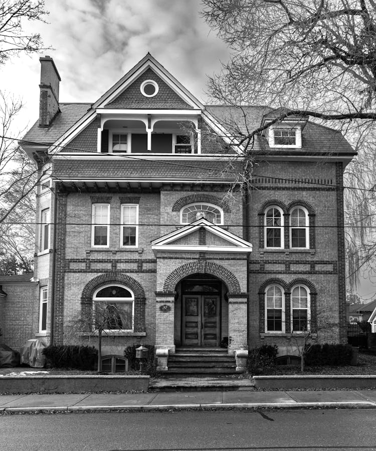 A Grayscale Photo Of A House