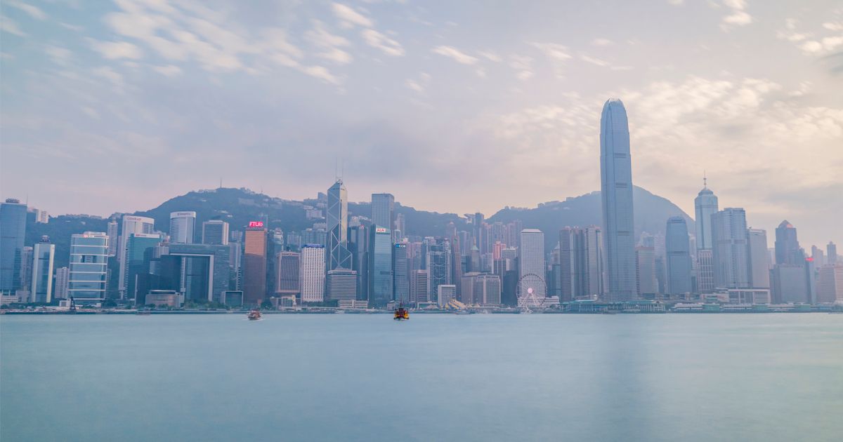 Hong Kong skyline seen across Victoria Harbour during the day.