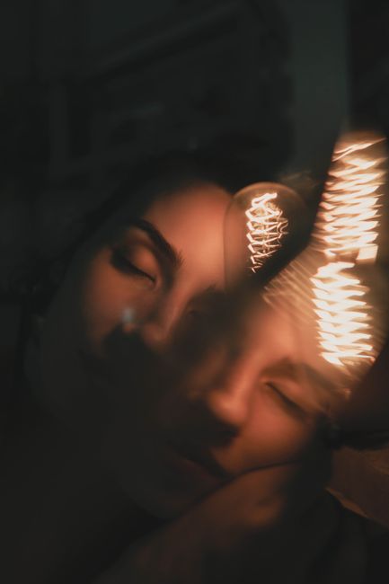 Ethereal portrait of a woman with light bulb glow in São Paulo.