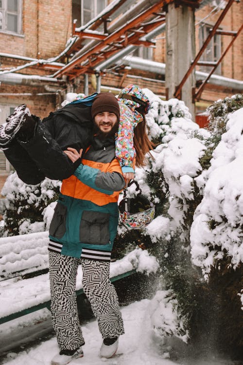 Young Couple Playing in Snow 