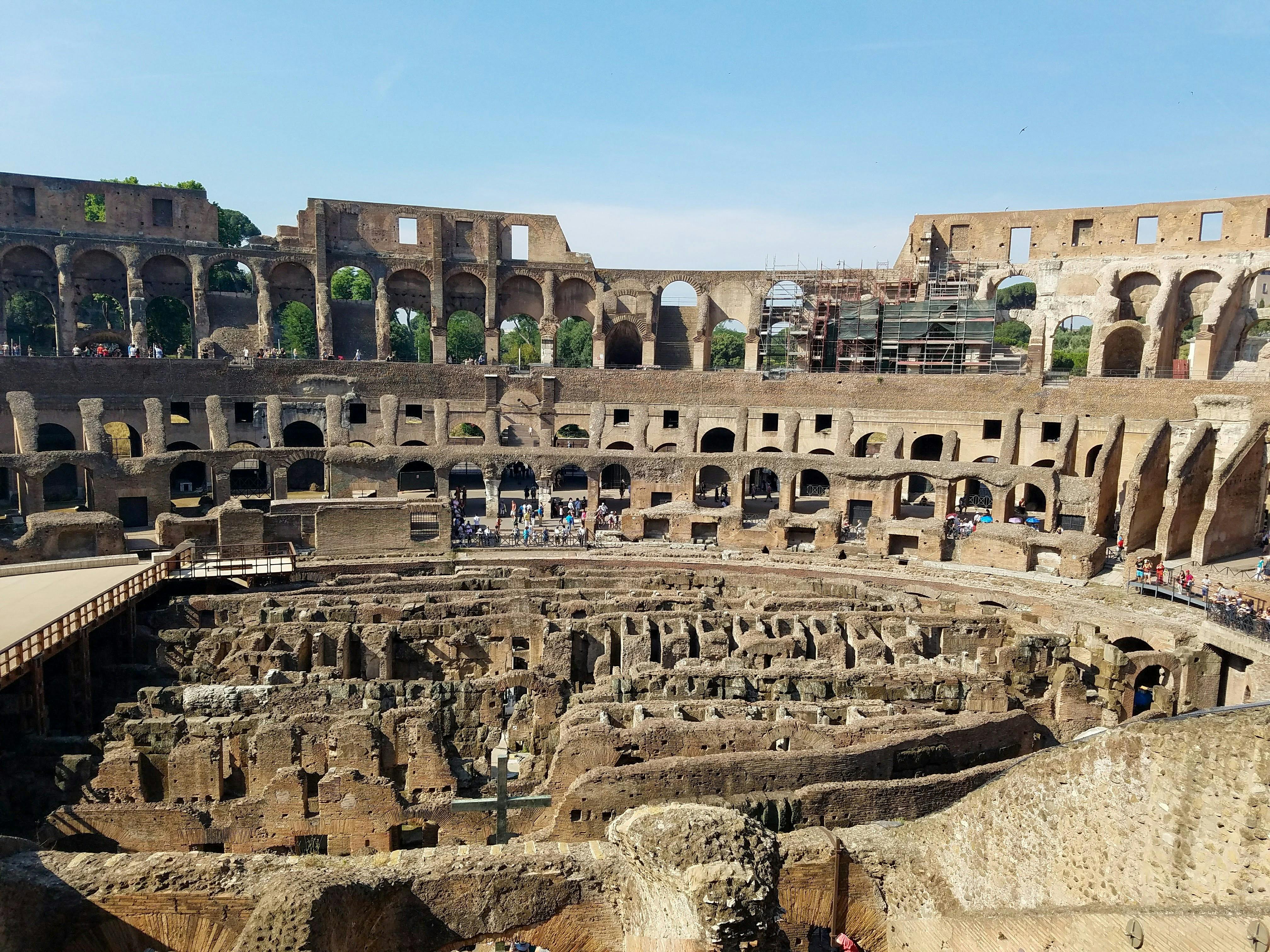 Free Explore the historic Colosseum amphitheater in Rome, a symbol of ancient Roman architecture. Stock Photo