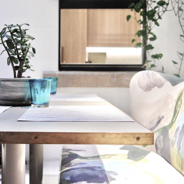 Contemporary dining area with potted plants — photo by Kate Branch on Pexels