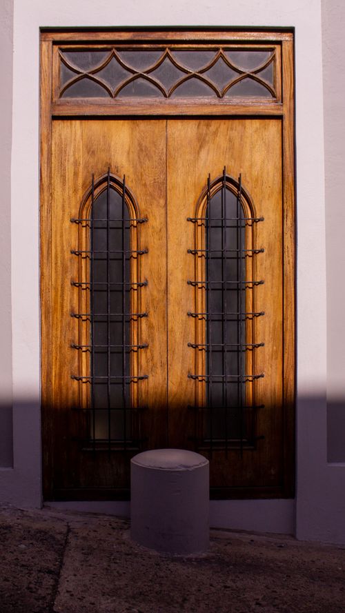 Free A detailed view of an ornate wooden door with ironwork in San Juan, Puerto Rico. Stock Photo