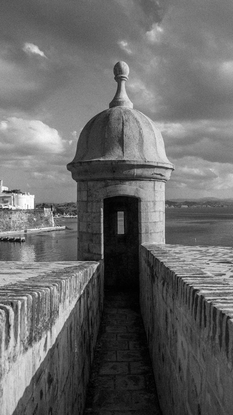 Grayscale Photo Of A Concrete Structure