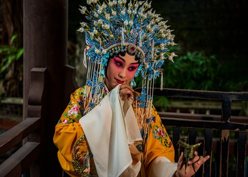 Free Portrait of a woman in traditional costume and headdress, showcasing Taiwanese culture. Stock Photo