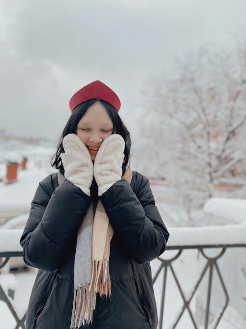 Woman in Winter Clothes Taking Selfie · Free Stock Photo