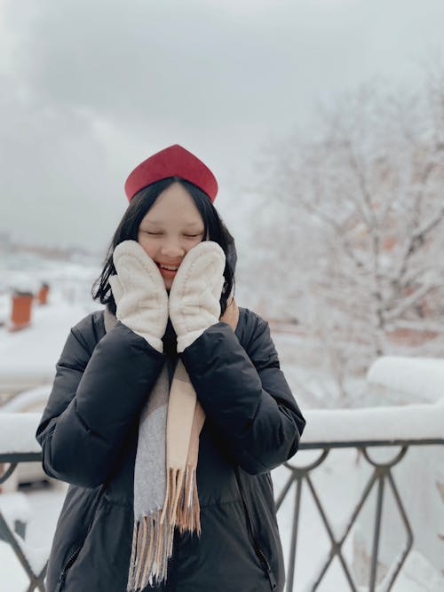 Girl in Black Jacket Covering Her Face with Her Hands