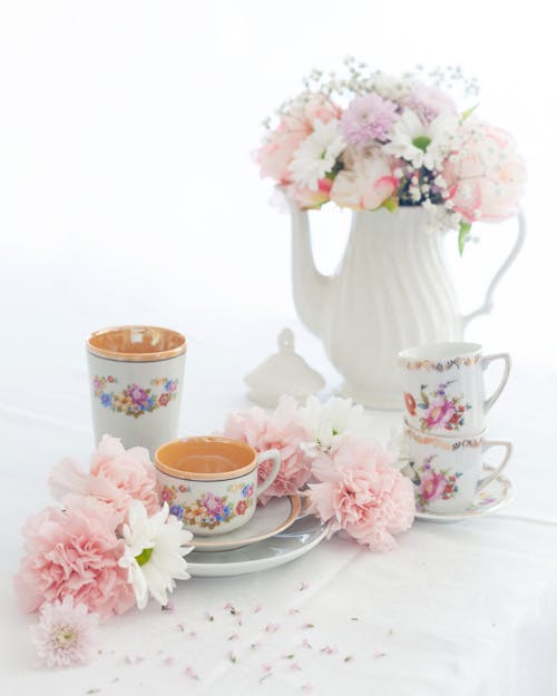 Free White and Pink Floral Teapot and Teacup Set Stock Photo