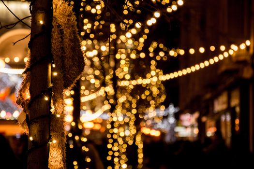 A vibrant night scene showcasing festive bokeh lights in Timișoara, Romania, capturing winter holiday spirit.