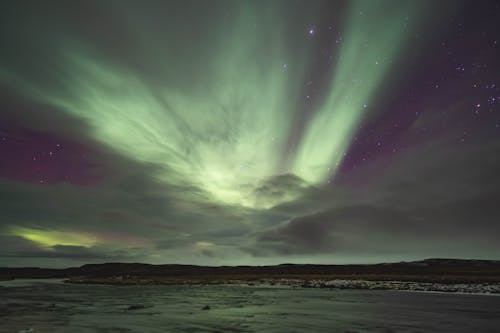 Body of Water Under Night Sky