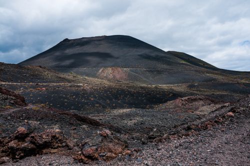 Free Dramatic view of the rugged Teneguía volcano in Spain under a cloudy sky. Stock Photo