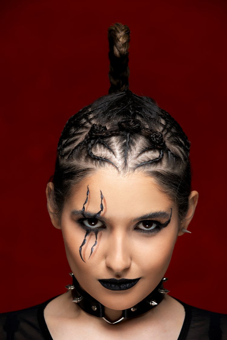 Portrait Of Woman In Artistic Makeup And Braided Hair