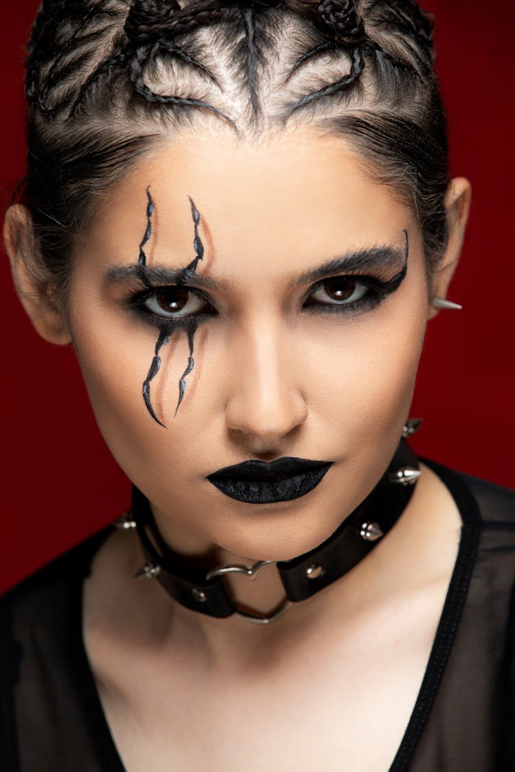 Portrait Of Woman In Artistic Makeup And Braided Hair