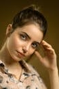Portrait of Woman Lightly Touching Her Face