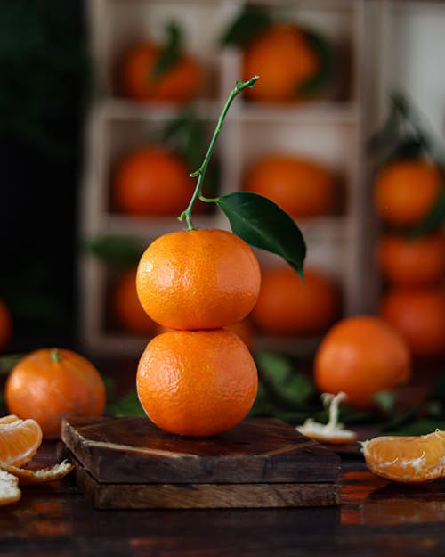 Free Shallow Focus of Fresh Orange Fruits on Wooden Surface Stock Photo