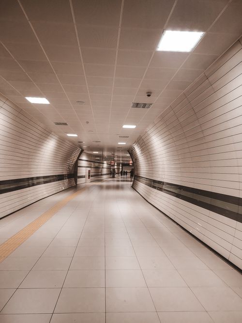 Free A sleek and modern underground tunnel in Istanbul with bright lighting and tiled walls. Stock Photo