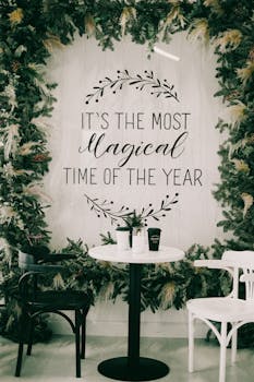 Minimalistic Christmas setup with a festive quote and greenery decor.