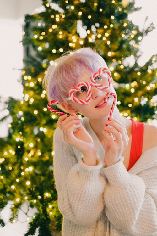 Beautiful Woman Holding Candy Canes