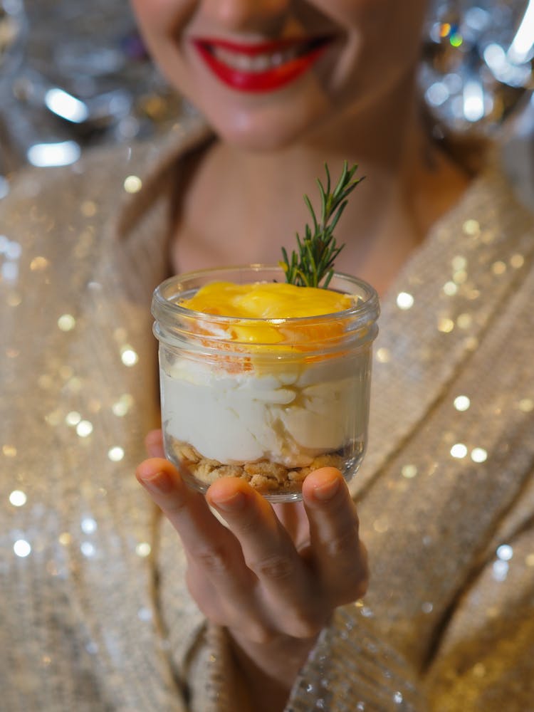 Woman Holding A Dessert In A Jar 