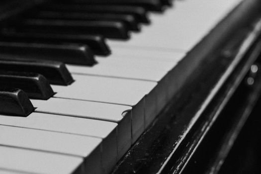 A monochrome close-up image of piano keys showcasing texture and detail.