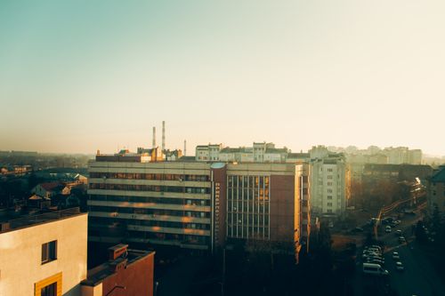 Free Aerial view of Ivano-Frankivsk cityscape at sunset, showcasing urban architecture and vibrant atmosphere. Stock Photo