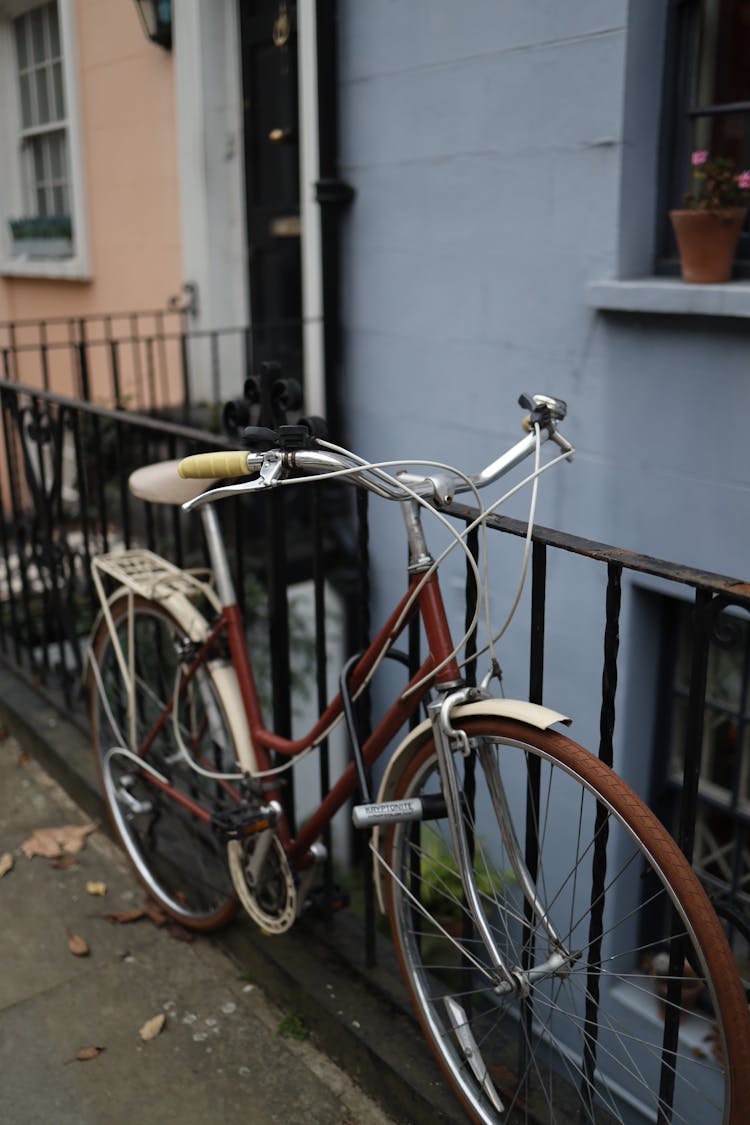 Bicycle Chained To A Fence 