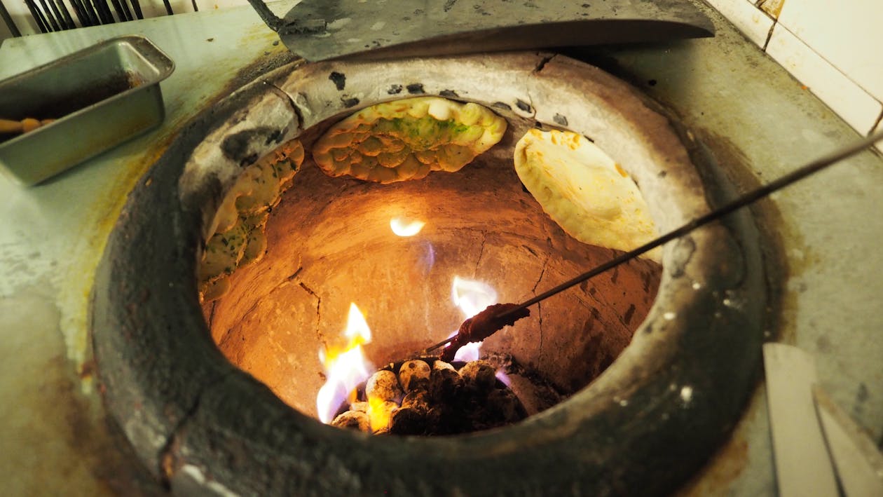 Free stock photo of clay oven cooking bread cooking naan bread Free stock photo of clay oven cooking bread cooking naan bread