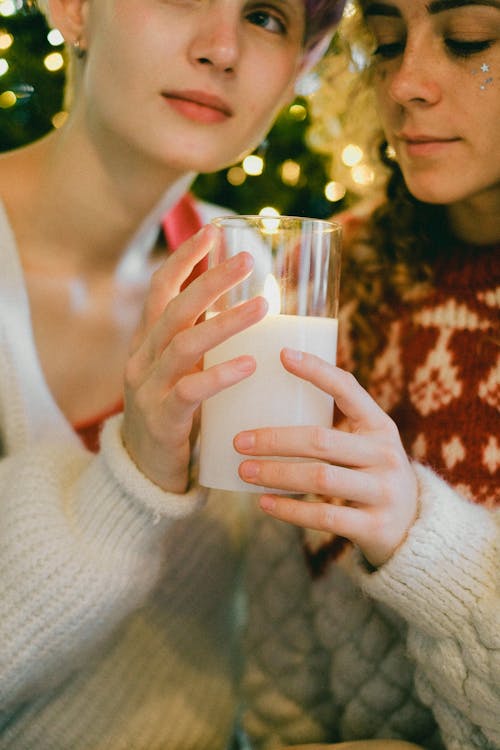 
Women Holding a Candle in a Glass