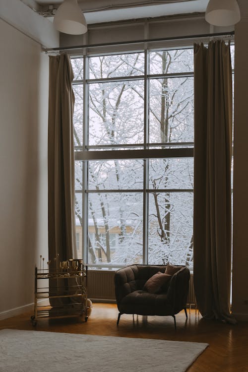 Armchair near Windows in Room