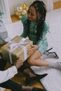 A Woman in a Green Dress Accepting a Present