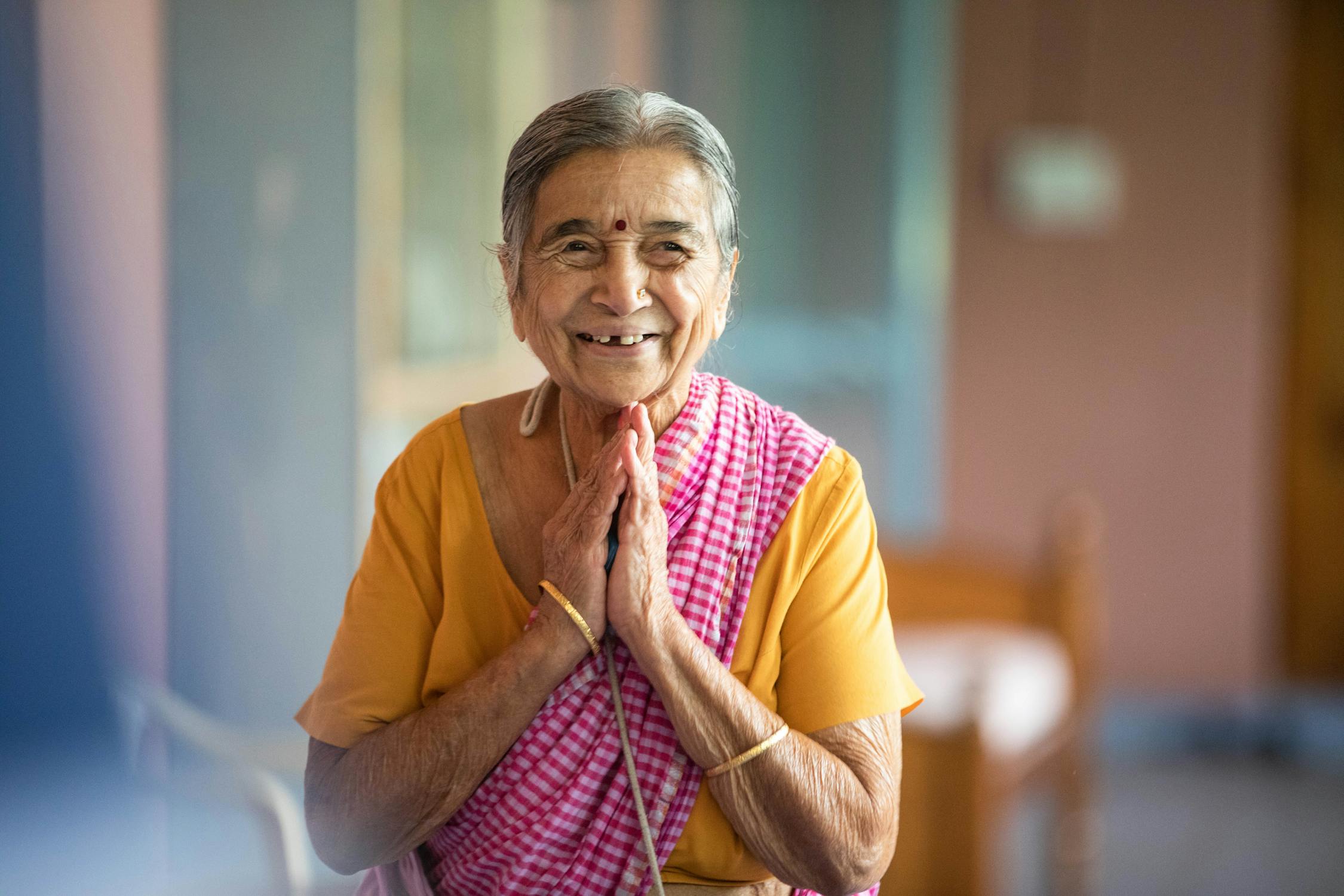 Senior Citizen Photo by Anil Sharma from Pexels: https://www.pexels.com/photo/an-elderly-woman-in-yellow-shirt-smiling-10597154/