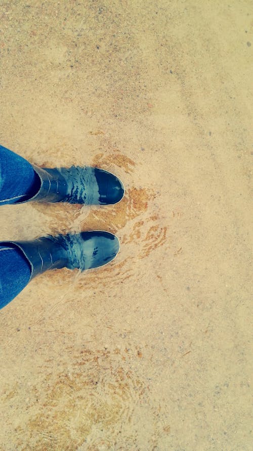 Person Wearing Blue Rain Boots