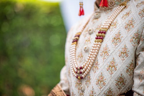 A Woman Wearing Pearl Necklace