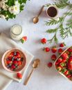 Porridge and Strawberries in the Bowl on the Table