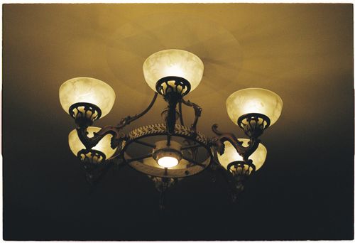 Free A classic chandelier with a vintage design, casting soft warm light in an elegant interior setting. Stock Photo
